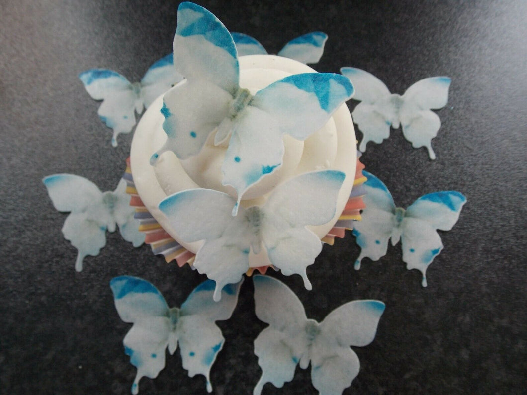 12 PRECUT Edible white and Blue Butterflies wafer paper cake/cupcake toppers(h)