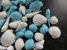 Load image into Gallery viewer, 40 Edible Blue and White Shimmery Sea shells fondant cake/cupcake toppers
