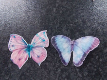 Load image into Gallery viewer, 14 Precut Edible Pink and Blue Butterflies for cakes and cupcake toppers
