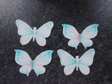Load image into Gallery viewer, 16 PRECUT Edible Baby Blue Butterflies wafer/rice paper cake/cupcake toppers
