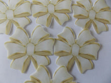 Load image into Gallery viewer, 12 PRECUT Edible Cream/Ivory Bows wafer/rice paper cake/cupcake toppers
