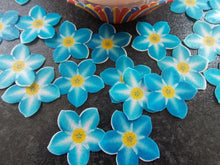 Load image into Gallery viewer, 24 PRECUT Edible Blue forget me not Flowers wafer paper cake/cupcake toppers
